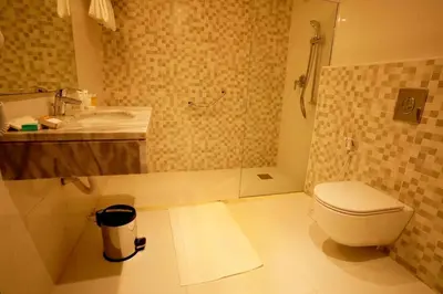 a bathroom with a toilet and a sink at Baity Boutique Hotel in Aqaba