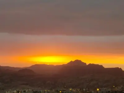 a sunset over the table mountain in cape town at Petra Stones Inn in Wadi Musa