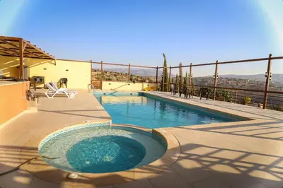 a swimming pool on top of a house at Sultana Farm - Private Pool Villa near Amman in Bayyūḑah
