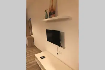 a living room with a flat screen tv on a wall at My Cosy little place in Amman