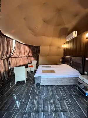 a bedroom with a large bed in a room at orbit camp 2 in Wadi Rum