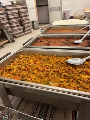 a bunch of food in trays in a kitchen at White Desert Camp in Wadi Rum