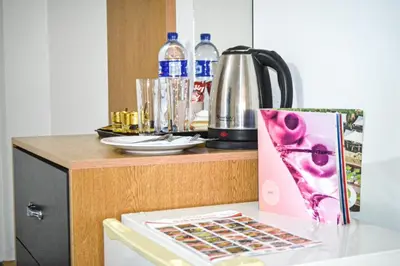 a table with a bottle of water and a box on it at Hikaya studios in Wadi Musa