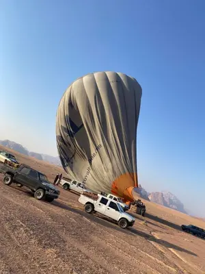 a hot air balloon in the middle of a desert at Rum Rayan magic camp in Wadi Rum