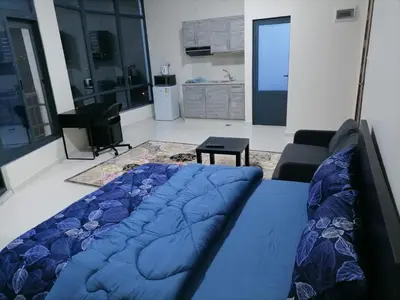 a living room with a couch and a table at For Women Only - للنساء فقط in Umm el ‘Amad