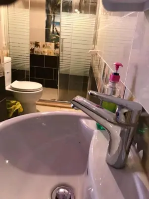 a bathroom sink with a bottle of soap on it at Rehana rum luxury camp in Wadi Rum