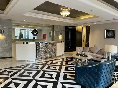 a lobby with a couch and a table in a room at Luxury Studio DAMAC TOWER - 1 BEDROOM -JORDAN in Amman
