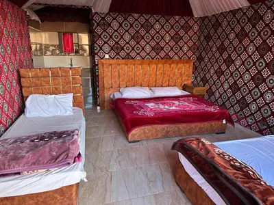a bedroom with two beds at Wadi Rum Story Camp in Wadi Rum