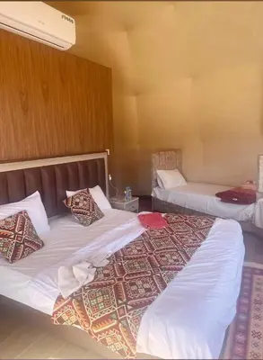 two beds in a hotel room with two bedsvisor at wadi rum land mars in Wadi Rum