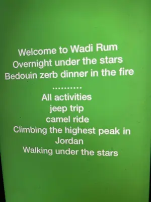 a green sign with the words welcome to walden runowment under the stars at wadi rum land mars in Wadi Rum