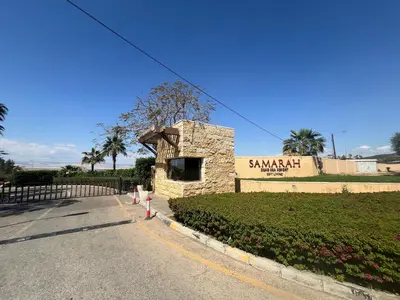 a stone building on the side of a road at Spacious apartments with Sea view at Samarah Resort in Sowayma
