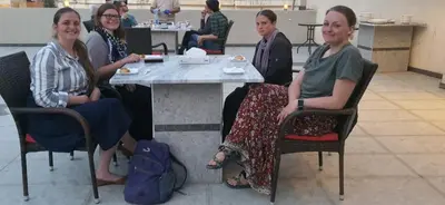 a group of women sitting at a table at petra agora hotel in Wadi Musa