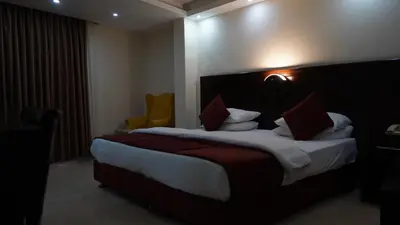 a bedroom with a large bed in a hotel room at petra agora hotel in Wadi Musa