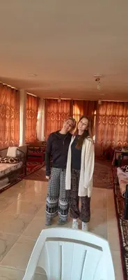 a couple of people standing in a room at private room with cultural experience and great landscapes in Şirfah