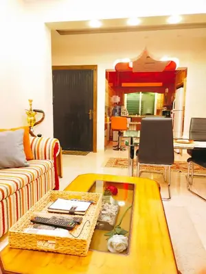 a living room with a couch and a coffee table at Maria Home in Madaba