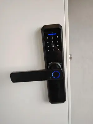 a black door handle on a white door at Rooftop one room غرفه نوم فقط in Amman