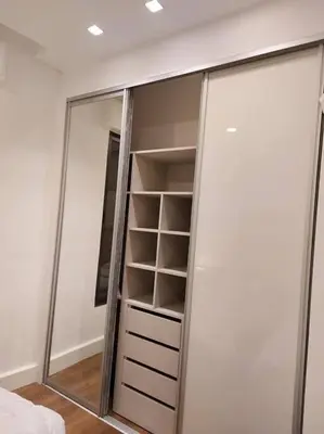 a mirror in a room with a closet at Exquisite Modern 2-bedroom Rental Unit in Amman