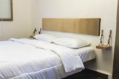 two beds sitting next to each other in a room at Petra NefNaf Hostel in Wadi Musa