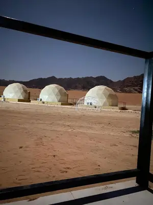 a view of three domes in the desert at Sandy Camp Wadi Rum in Wadi Rum