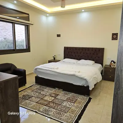 a bedroom with a large bed in a room at Authentic boutique in Wadi Musa