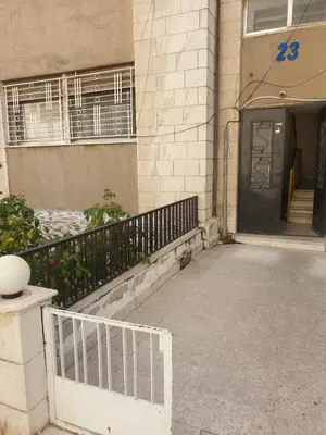 a entrance to a building with a door and a staircase at شقة مفروشة في ام اذينة in Amman