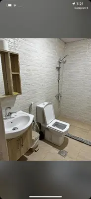 a bathroom with a toilet and a sink at Wadi Rum Magic Camp in Wadi Rum