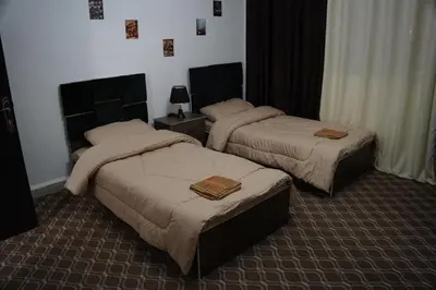 a hotel room with two beds in a room at Petra voyager Hostel in Wadi Musa