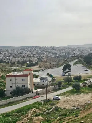 a view of a city with a street and a road at Jerash -HeritageHotel in Jerash