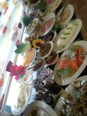 a bunch of plates of food on a table at Ibiza Hotel in Amman