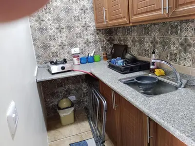 a kitchen with a sink and a counter top at family studio in Wadi Musa