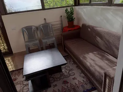 a living room with a couch and two chairs at family studio in Wadi Musa