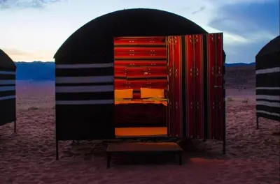 a black and red capsulebedroom in the desert at Wadi Rum Desert Stars in Wadi Rum