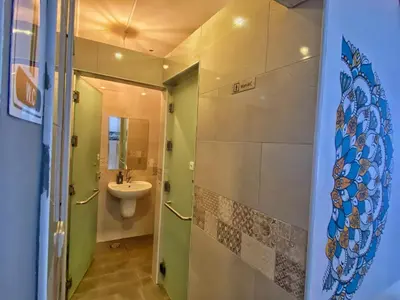 a bathroom with a sink and a toilet at The Castle Star in Amman