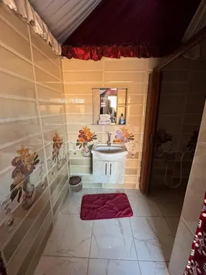a bathroom with a sink and a mirror at Wadi rum under stars in Wadi Rum
