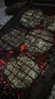 a bunch of food is cooking in an oven at Night Magic Camp in Wadi Rum