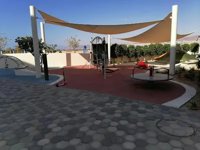 a playground with a tent and a slide at Blue Diamond Ayla - Restricted to Family stays in Aqaba