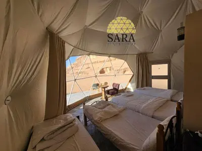 a room with two beds in a tent at SARA lUXURY CAMP in Wadi Rum