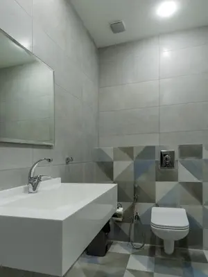 a bathroom with a white sink and a toilet at Prestige Hotel Suites - برستيج للشقق الفندقية in Amman