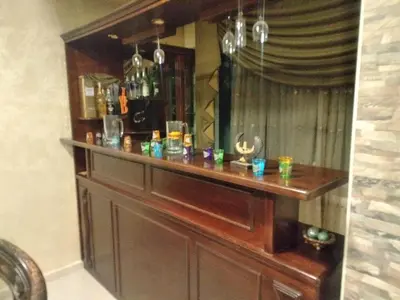 a bar in the corner of a room at City Center Furnished Apartment in Madaba