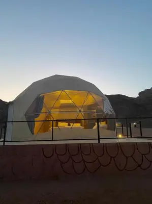 a domed building with a glass dome on top at Jawharat Rum camp in Wadi Rum