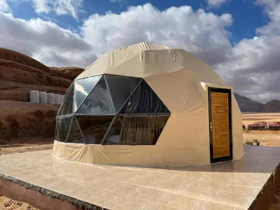 a dome tent in the middle of the desert at Jawharat Rum camp in Wadi Rum