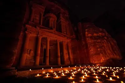 a bunch of candles in front of a building at Issa Snaffi Bedouin home in Wadi Musa