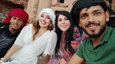 a group of people are posing for a picture at Issa Snaffi Bedouin home in Wadi Musa