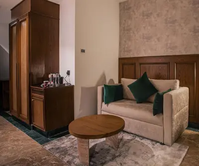 a living room with a couch and a table at Bratus Hotel in Aqaba