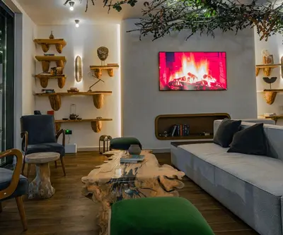 a living room with a couch and a fire place at Bratus Hotel in Aqaba