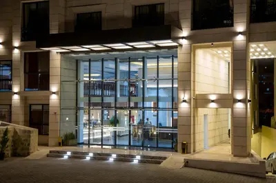 a large building with a large glass door at Petra Moon Luxury Hotel in Wadi Musa