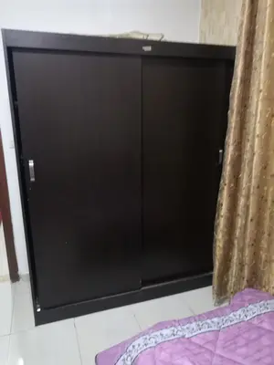 a black cabinet in a room with a curtain at Al-Shokhaibie 51 Building- Soufan Studios in Ţāb Kirā‘