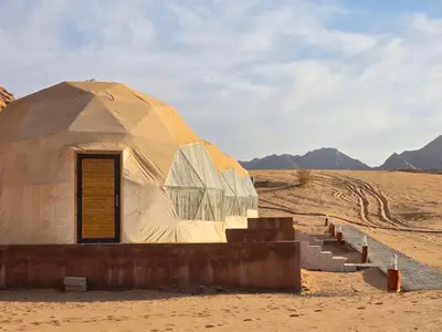 a dome tent in the middle of the desert at Scarlet Luxury Camp Wadi Rum in Wadi Rum