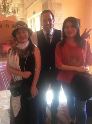 a man and two women posing for a picture at Cozy House in Wadi Musa