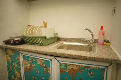 a kitchen counter top with a sink and a sink at Petra Main Gate Studios in Wadi Musa